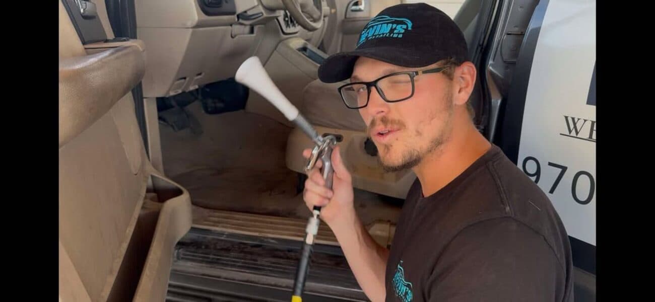 Nevin detailing a vehicle interior on location